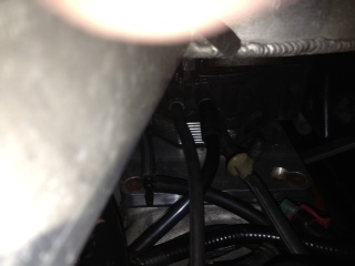 Bad picture of front of TBI hoses….